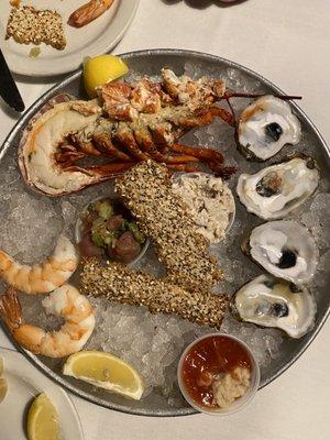 Seafood platter App. Fla Lobster, shrimp, oysters, smoked fish dip & Tuna Tartare. The photo was an after thought.