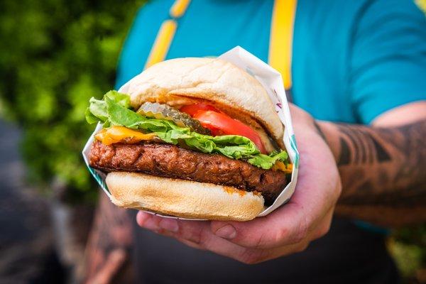 Smashed burgers with carmelized onions, fresh veggies and a chef's touch.