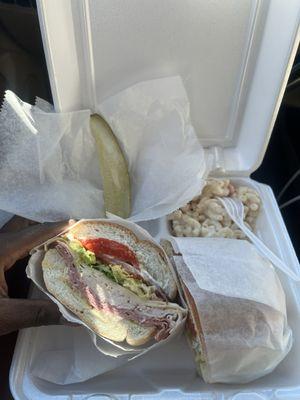 Turkey, ham, and provolone cheese sandwich with a Side of Macaroni Salad