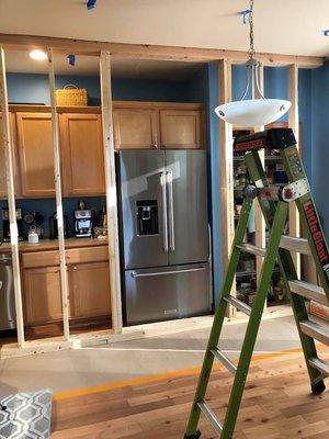 Support wall in kitchen during structural repairs.