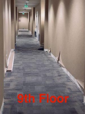 The 9th floor hallway has been missing moulding and dry wall for over 3 years after a rooftop flood.