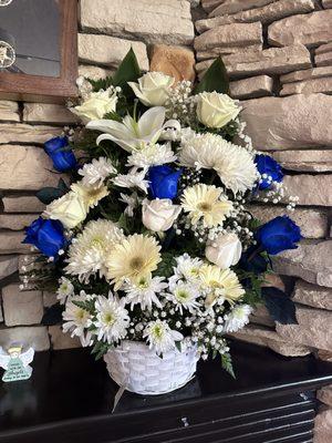 Flower arrangement with the requested blue touch added in.