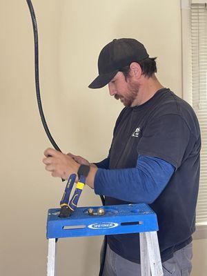 Chris preps a Mini-Split Head communication wire