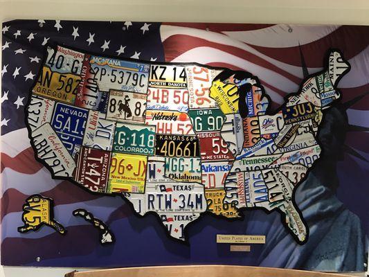 A cool display located on the 3rd floor, south elevator. It has a license plate from each respective state.