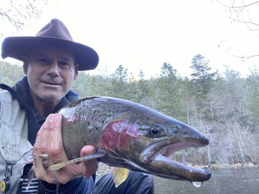 Shop owner, Derek Mitchell with wild Steelhead