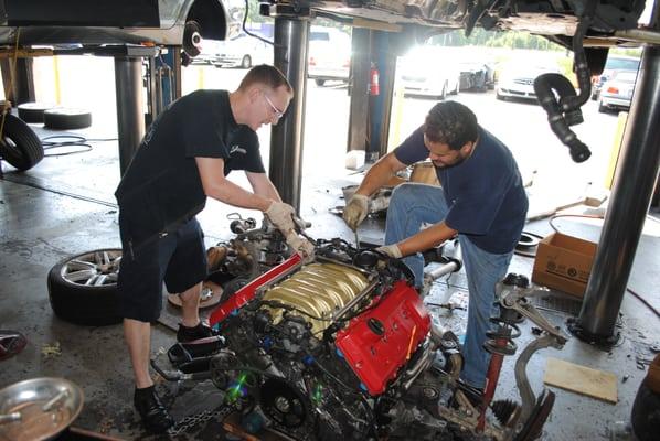 Techs working hard on a large engine