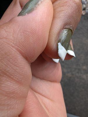 Nail polish doesn't touch the edge of the nail; you can see the French caked on