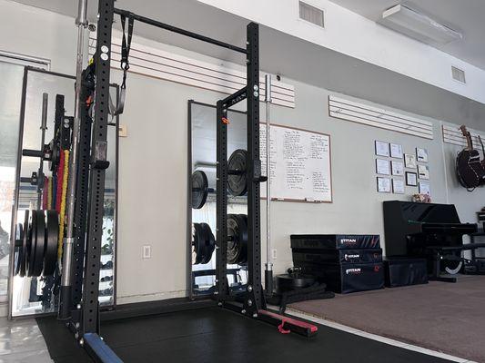 squat rack, plyometric boxes and battlerope