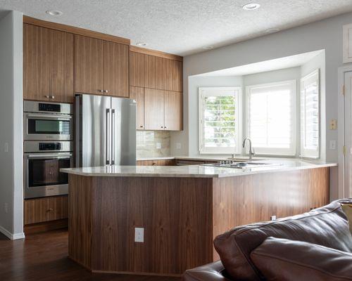 -Walnut Kitchen, with Taj Mahal Countertops.