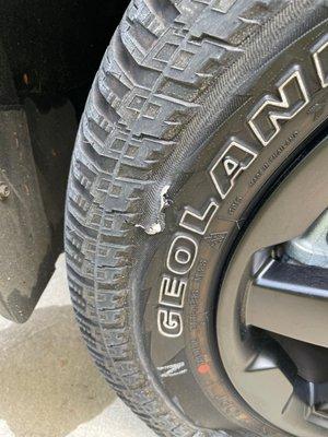 Slashed tire from conveyor belt