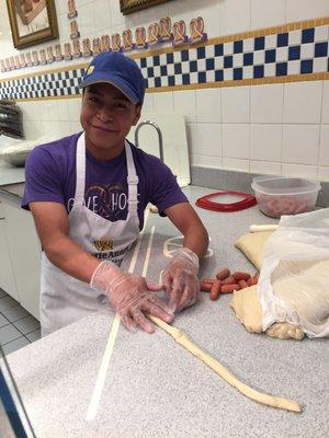 Busy at work making yum pretzels.