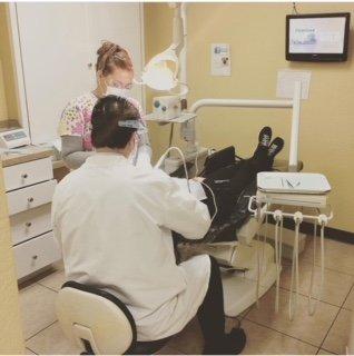 Dr Velazquez doing what he does best; giving a patient a beautiful smile