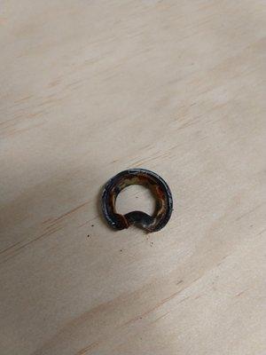 Bent rubber washer in water heater intake flex valve, caused rust between dissimilar metals