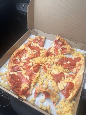 Large pepperoni pizza with pineapple