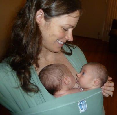 Babywearing is welcome during class!  Sarah can show you ways to wrap your children--here she is wearing her twins.