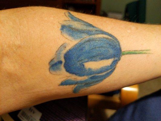 Blue tulip tattoo by Mark Harada from a watercolor by Steven Barbash