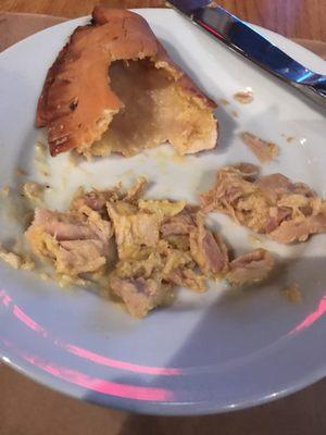 Half an empanadas with chicken filling removed