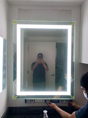 Installation of new
Lighted Mirror in  Bathroom