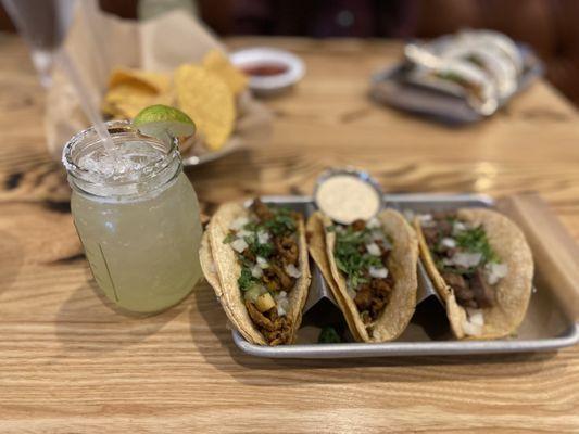 Al pastor taco, chorizo taco, and carne asada taco with margarita