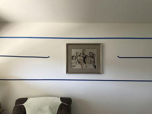 Blue tape has been on my walls for 2 years, waiting for the shelves to be put up.