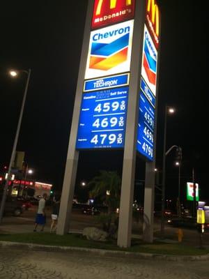 Almost unnoticeable sign that reads "cash chevron card price". No sign anywhere stating that all others pay 20¢ more per gallon!