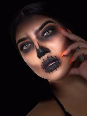 Bold and beautiful skull makeup - perfect for your Halloween transformation! Book your spooky glam look today!