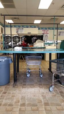 They have pokes on the folding tables to hang clothes, love this!