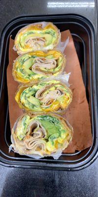 Brunch veggie omelette with turkey avocado and veggies on a wrap