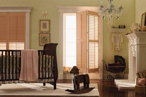 Light wood shutters with a bi-fold door is perfect for any room.