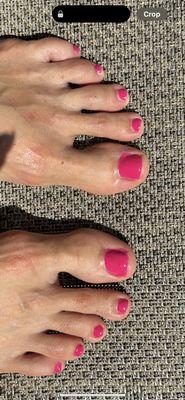 Gel pedicure polish all around my bordering skin on big toes. This is after I requested to have it fixed.