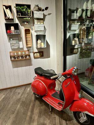 Vespa motorcycle inside the store