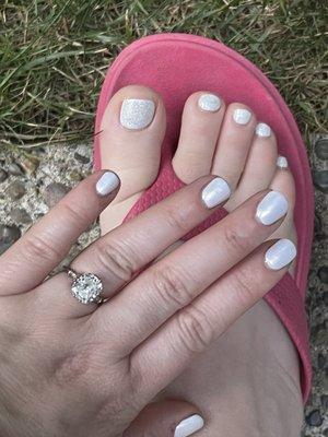 White chrome on my fingernails and sparkly white polish on my toes