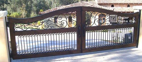 San Diego Iron Gates and Driveway Gates.
 
 This is an ornamental and wrought iron wood gate in San Diego.