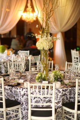 Damask linens, white chiavari chairs and pops of green!