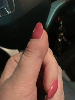 Awful, unnatural looking thumb nail. It bends back. This nail just looks silly and out of place.