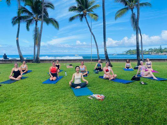 This is a real photo of the great oceanfront lawn and yoga students.