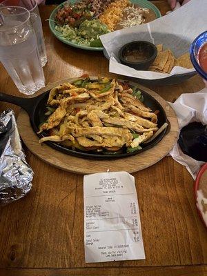 Chicken fajitas and carnitas plate along with the ridiculously priced "cash" receipt