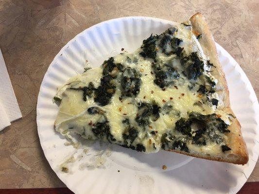 White pizza with spinach.