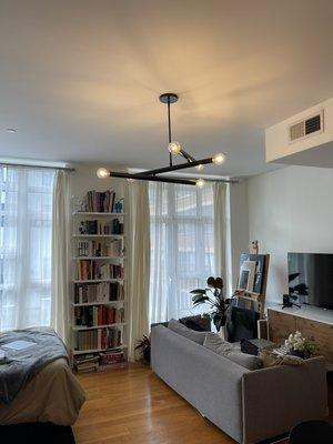 Replaced chandelier with moderate light fixture