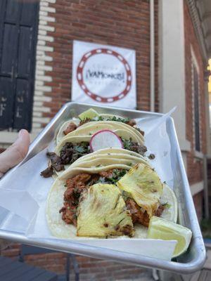 A taco trifecta at the abbot square patio seating.