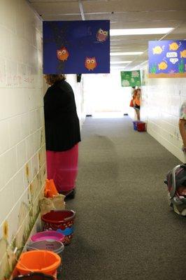 The halls of Pomerado Christian Preschool and the buckets lined up on the side