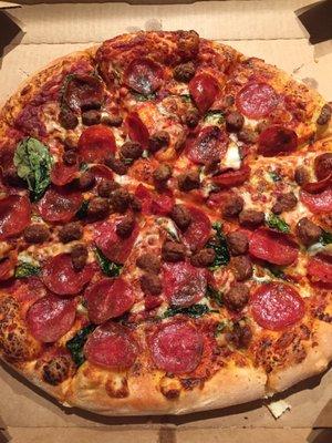 Large pizza with pepperoni, sausage, and spinach