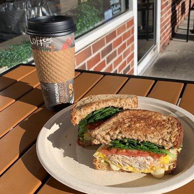 The "Joe" sandwich.  Turkey, two eggs, cheese, spinach, avocado, tomato, sriracha aioli on wheat toast.