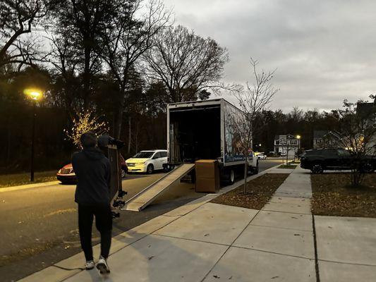 Pool table being loaded onto truck