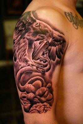 Eagle and snake tattoo