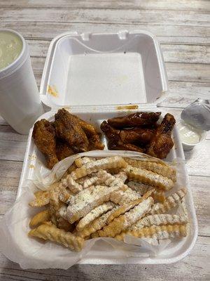 Half Teriyaki and half honey hot garlic wings with fries that I added ranch seasoning to and a lemonade