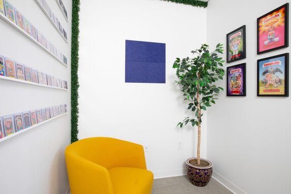 Meeting room with yellow chair and blue paneling