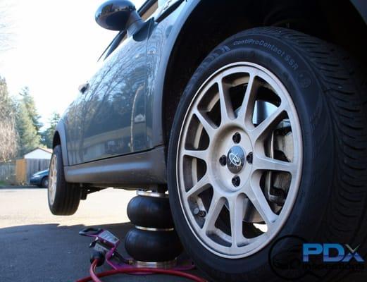 Vehicles are properly lifted to inspect the frame/unibody/suspension/brakes/tires and steering components