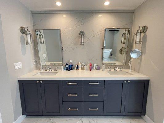 Master vanity with quartz backsplash