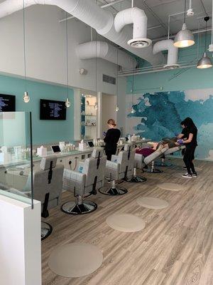 The facial bar has 6 reclinable chairs and TVs that play movies while you get a facial!